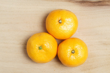 Fresh oranges on the wooden table