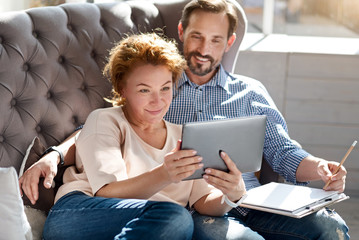 Woman taking selfie with her husband