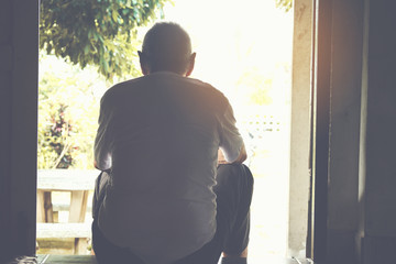 lonely old man sitting at Home