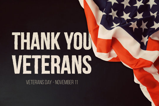 Veterans day background with text and USA flag