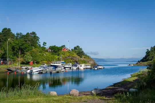 Typical nordic bay with recreational boats moored