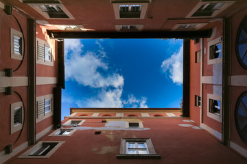 Fototapeta na wymiar Sky and clouds between the historical buildings in Rome
