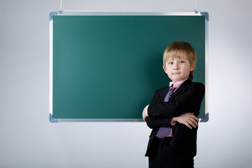 little funny boy with blackboard