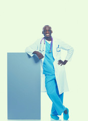 Male doctor holding empty placard.