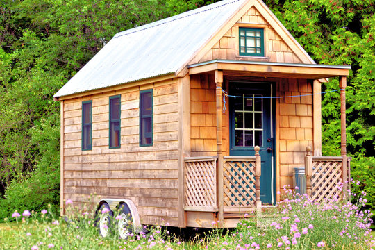 View of tiny house with porch
