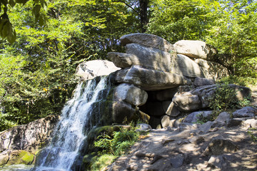 Naklejka na ściany i meble Beautiful stone falls in the sofiyevsky park of Ukraine.