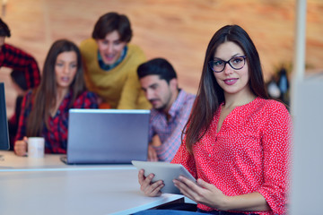 Young professionals work in modern office.Project manager team discussing new idea.Business crew working with startup.Desktop computer table,showing presentation, monitor.Blurred,film effect.