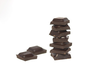 Pyramid of chocolate bar on white background.