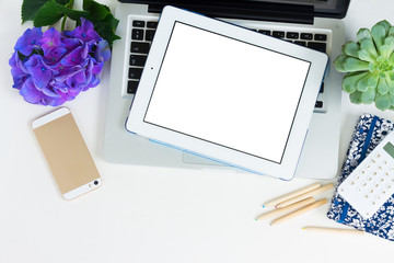 Modern Laptop, phone and tablet on white table mock up flat lay scene, copy space on blank screen