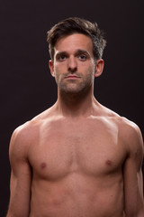 Fototapeta premium confused young man shirtless nude chest head face