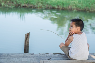 Little Boy Catching a Fish. Kids Fishing.