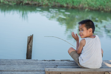 Little Boy Catching a Fish. Kids Fishing.