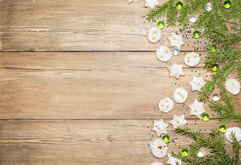 Christmas background of fir branches and ginger cookies