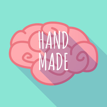 Long shadow pink brain icon with    the text HAND MADE