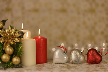 Fototapeta na wymiar Christmas greeting card with tree, candles, lights and hearts decorations.