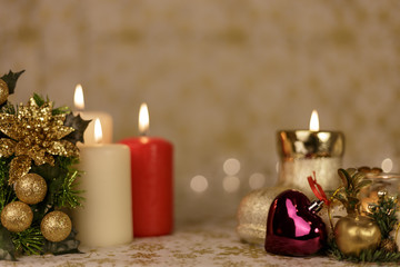 Christmas greeting card with tree, candles, lights, boot and purple heart decoration.