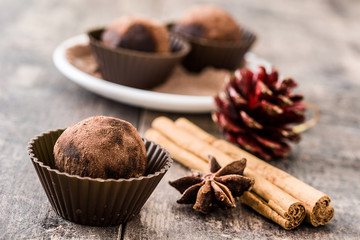 Christmas chocolate truffles on wooden table

