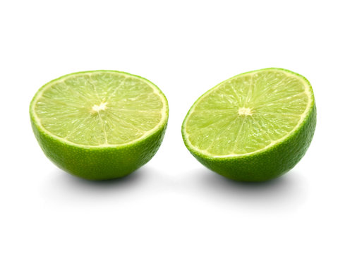 two halves of lime isolated on white background