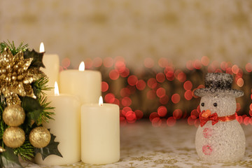 Greeting card with Christmas tree, candles, lights and heart decoration.