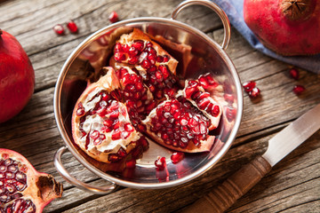 Pomegranates on wooden table