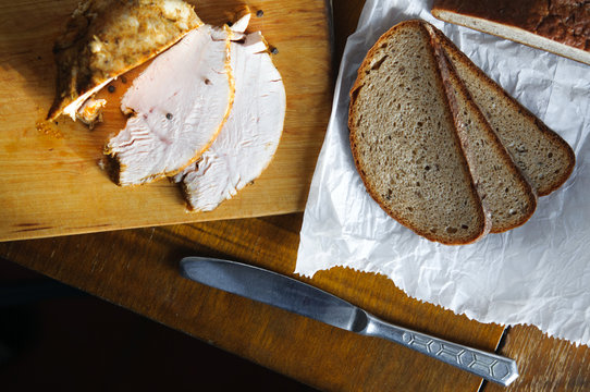 Roast Turkey Meat And Bread On Old Cutting Board, Vintage Country Table