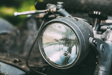 Close View Of Headlight Of Old Rarity Gray Tricar Or Three-Wheeled Motorbike With A Sidecar.
