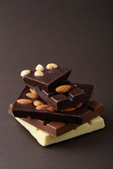 Chocolate with nuts on dark background