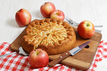 Homemade apple pie on white table
