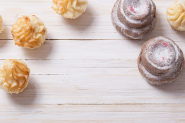 Fototapeta premium cakes on white wooden background