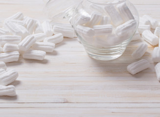 white marshmallows on wooden background