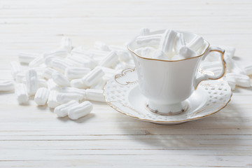 white marshmallows on wooden background