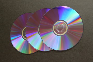 compact discs on a dark background
