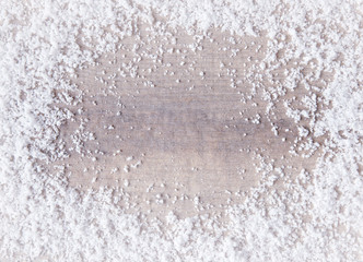 Wooden surface covered with snow