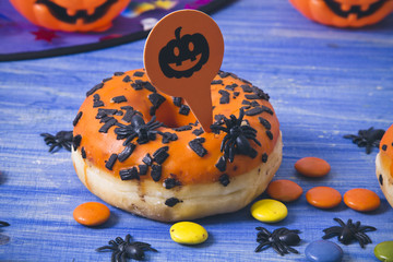 halloween sweets and candies on blue wooden