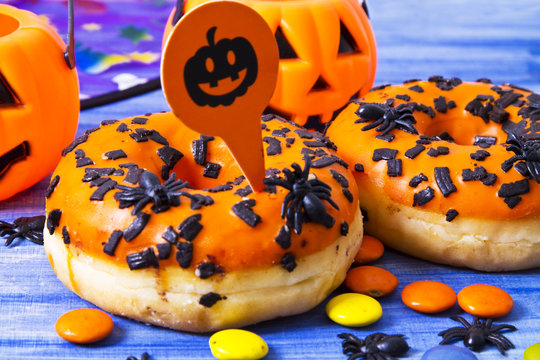 halloween sweets and candies on blue wooden