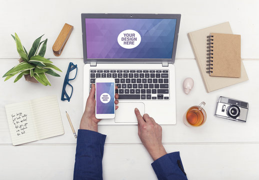 Laptop and Smartphone with User at Desk Mockup