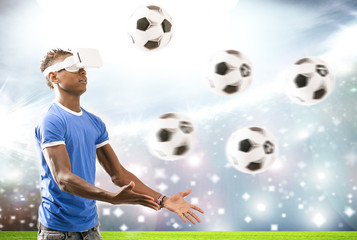 Young man with virtual reality headset or 3d glasses over football field on stadium background