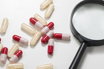 Group of antibiotics and  probiotics capsule with magnifying gla