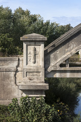Fototapeta na wymiar Fascist symbol was on an old bridge
