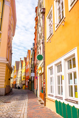 Narrow street view with colorful houses in Landshut bavarian town, Germany
