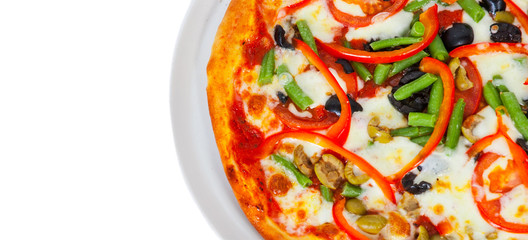 vegetarian pizza with vegetableson a white plate. isolated on white. top view