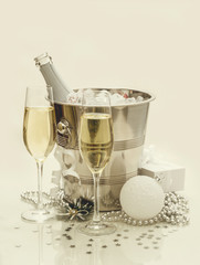 Two champagne glasses, cooler