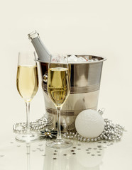 Two champagne glasses, cooler