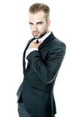 Handsome bearded man wearing suit, portrait shot in studio