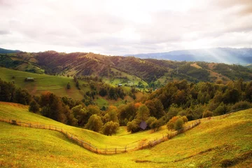 Tafelkleed Farmland on the hill side under dramatic cloudy sky © oliverleicher