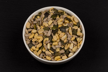 mixed seeds in wooden bowl