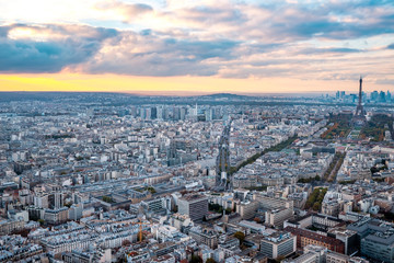 Aerial Paris view in late autumn from Montparnasse Tower at sunset. Eiffel Tower in the distance and financial district.