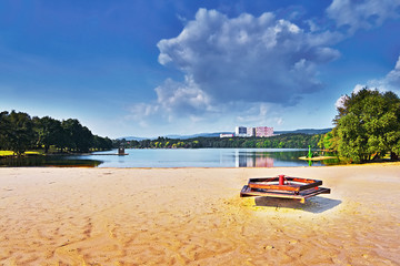 empty carousel on the sandy beach of Alum Lake Kamencove jezero in Chomutov  at the end of the summer tourist season in the Czech Republic