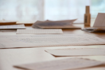 Documents and business papers are on the table on blurred background