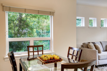 Fresh apples on modern dining table . Apartment interior